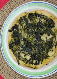 pizza topped with rapini